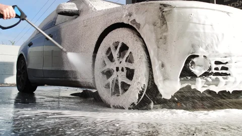 Car exterior being rinsed during a car wash