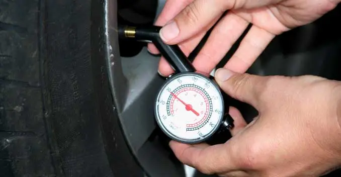 Tyre pressure being checked after nitrogen filling