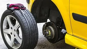 Old tyre being removed from a car