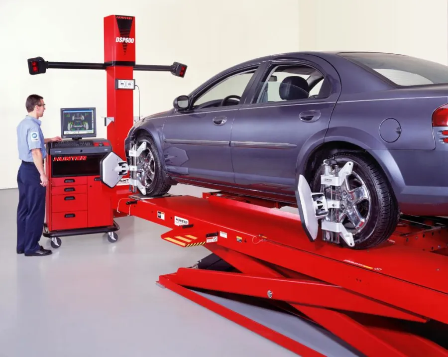 Car on the service bay at Sadguru Automobiles tyre shop in Raipur