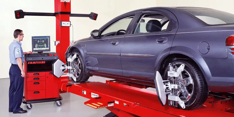 Balancing weights being fitted to a wheel rim